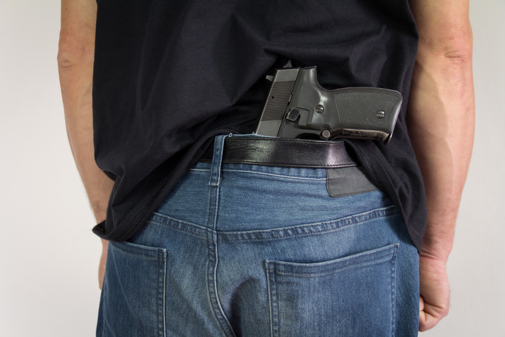 gun nestled in the back pocket of an individual in Chicago