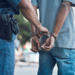 man in Chicago being arrested for unlawful gun possession