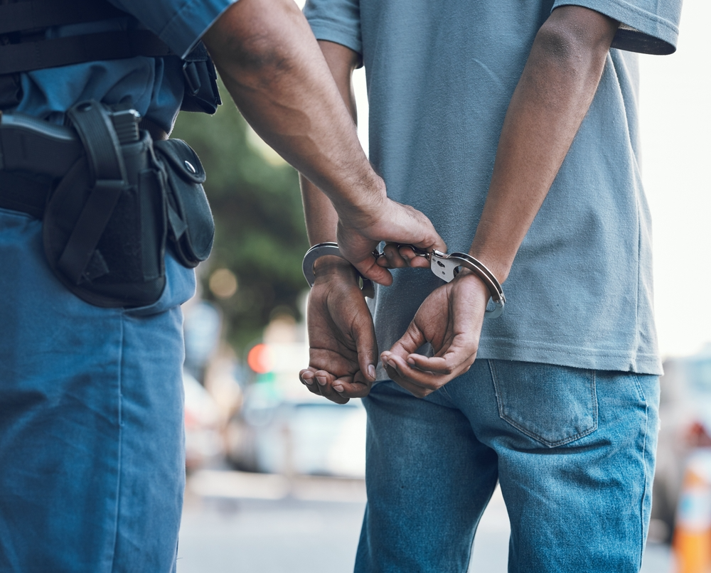 man in Chicago being arrested for unlawful gun possession