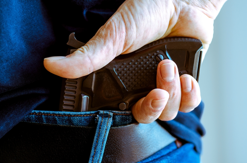 man with a gun in his back pocket in Chicago